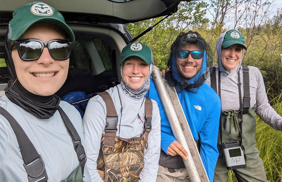 Kelly Wrighton (at right) and her three grad students pose for a photo