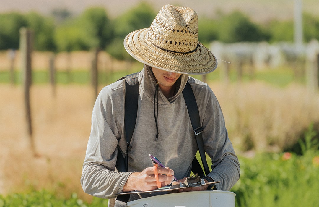 Man taking notes about ag science.