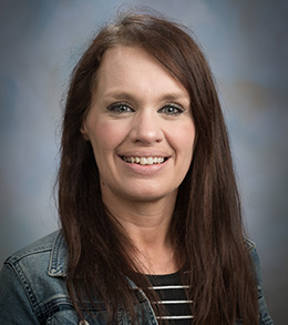 Smiling woman with long brown hair