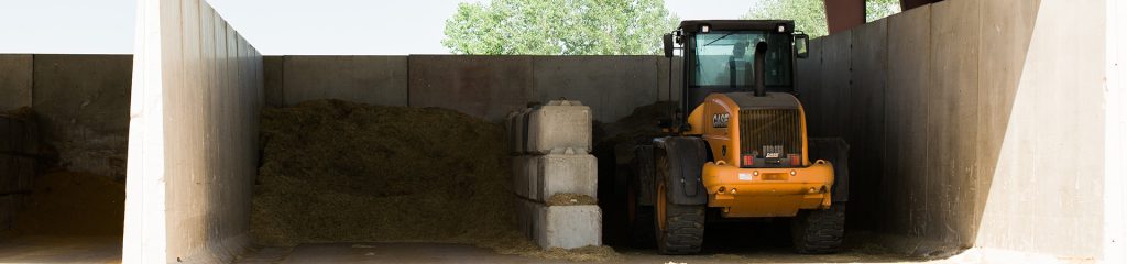 A loader in a commodity barn.