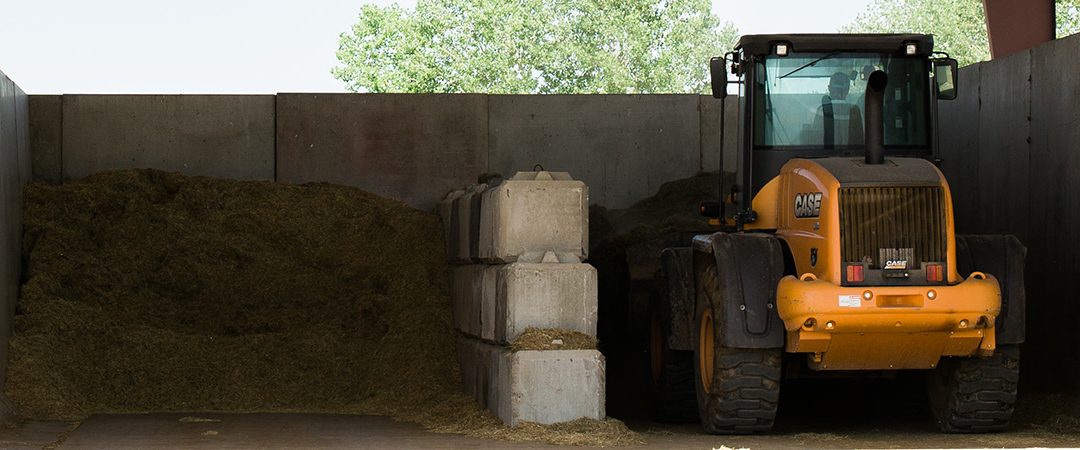 A loader in a commodity barn.